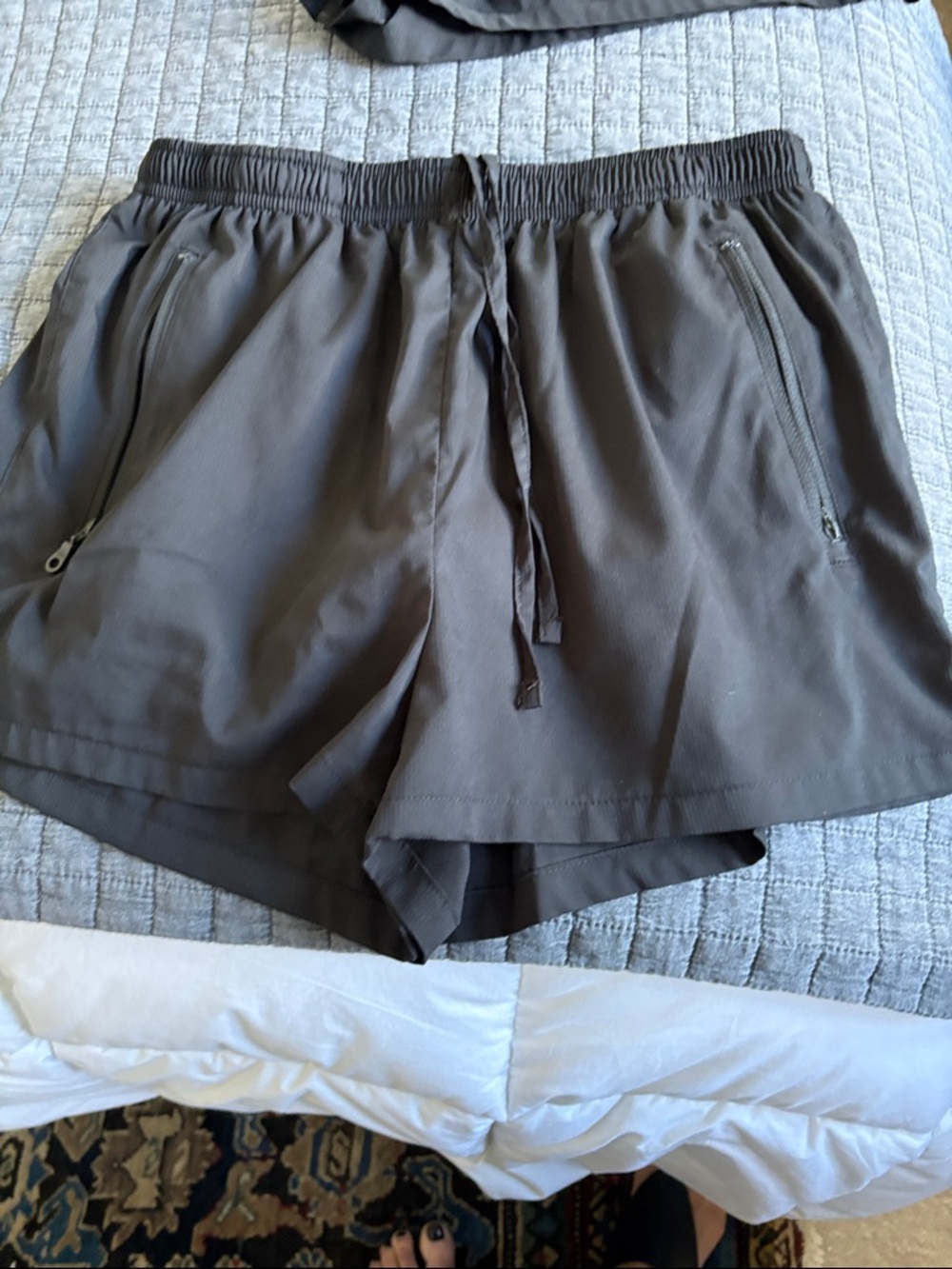 girlfriend collective black athletic shorts with zip pockets